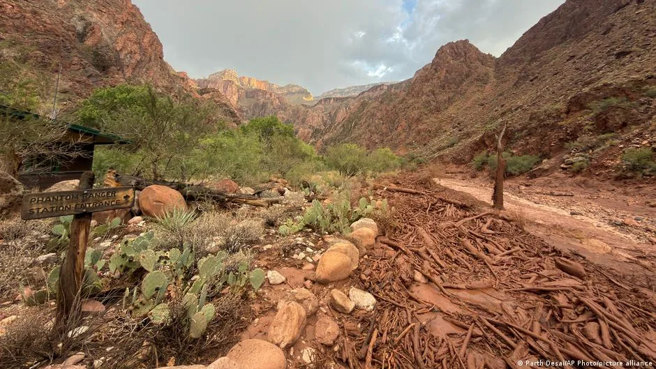 Floodwater and debris moving through a canyon area at Grand Canyon National Park