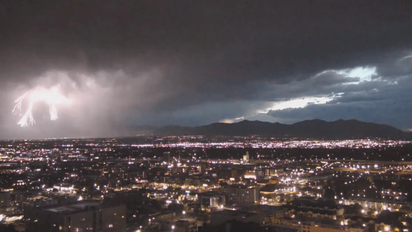Dark storm clouds over Utah neighborhoods during a severe thunderstorm warning
