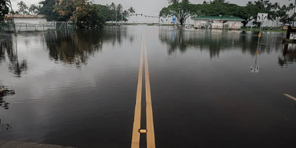 Flooded road and storm damage in Hawaii after Hurricane Lala
