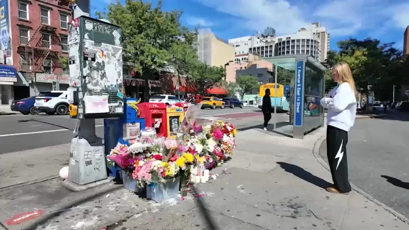 Flowers and tributes at an East Village crash memorial near 14th Street and First Avenue
