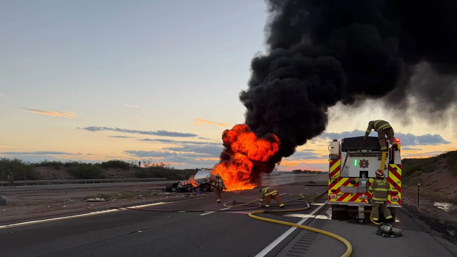 Fire crews and police response near a fuel truck crash on Interstate 25
