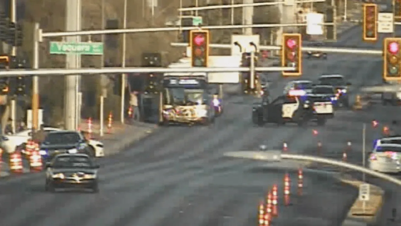 Police investigate a crash scene at a Las Vegas intersection with traffic blocked off