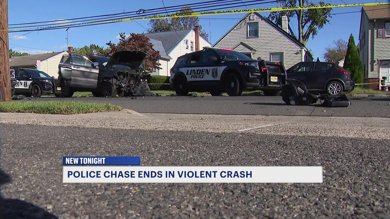 Damaged vehicles and a child safety seat on East Linden Avenue after a crash in Linden